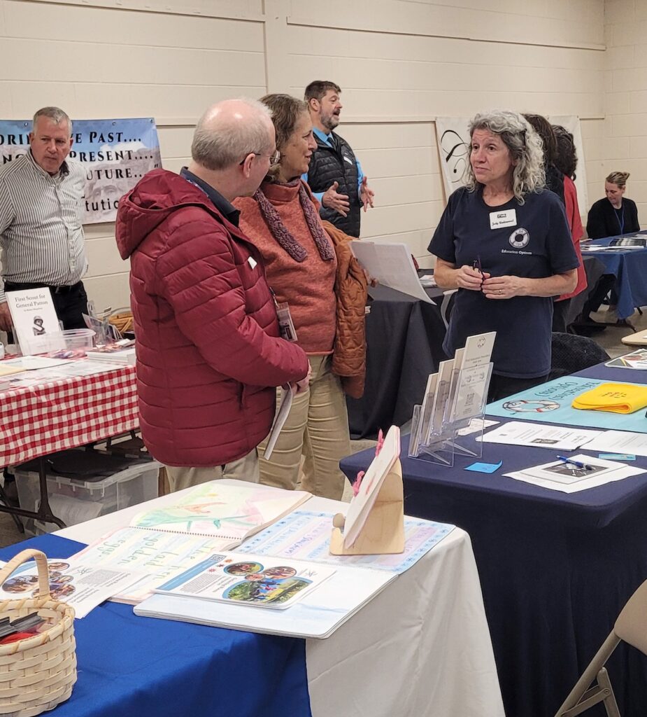 Man and woman engaging with woman in front of table