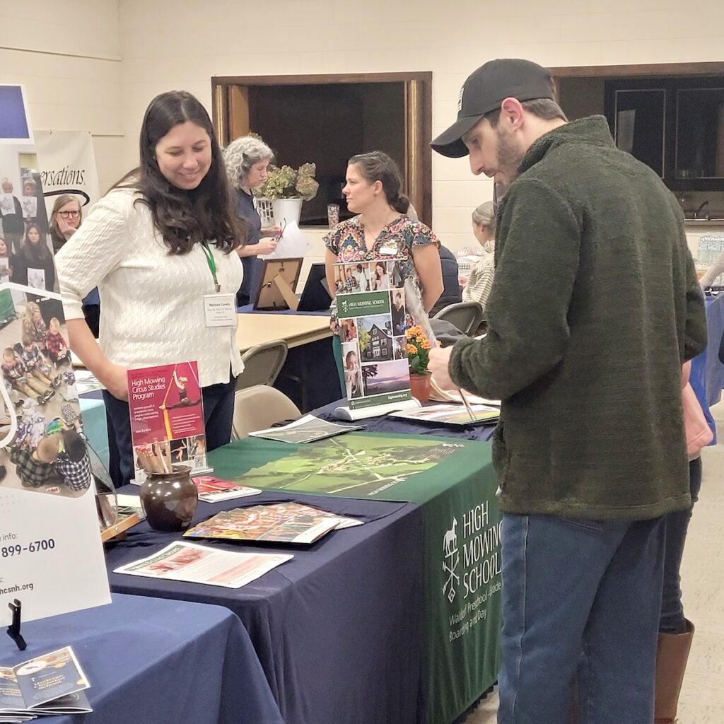 Family engaging with woman behind table