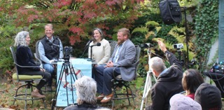 Jody Underwood moderates a Choosing School panel with Frank Edelblut, Jaime Koladish, and Robert Qua, with seated audience members and a camera in the foreground.