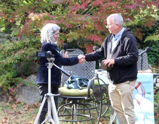 Jody Underwood shakes hands with Hal Shurtleff during the inaugural EdOpt Beacon Award presentation.