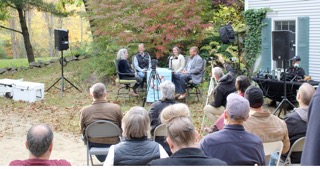Rows of seated guests watch the outdoor Choosing School podcast panel at EdOpt’s 2026 Donor and Volunteer Appreciation Gathering.